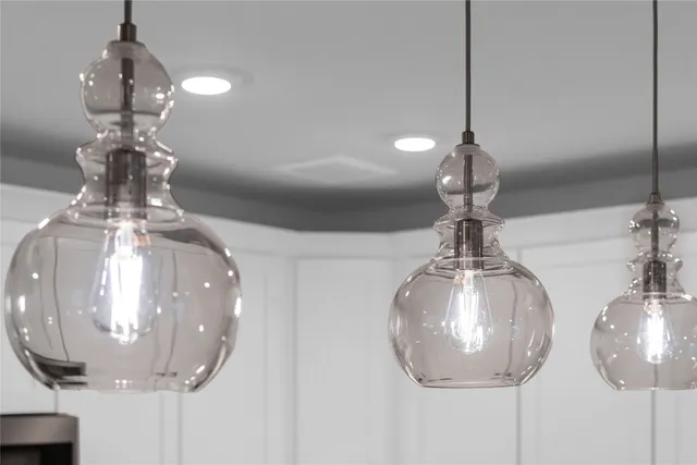 a kitchen with stainless steel appliances granite countertop a sink stove a refrigerator and a oven with wooden floor