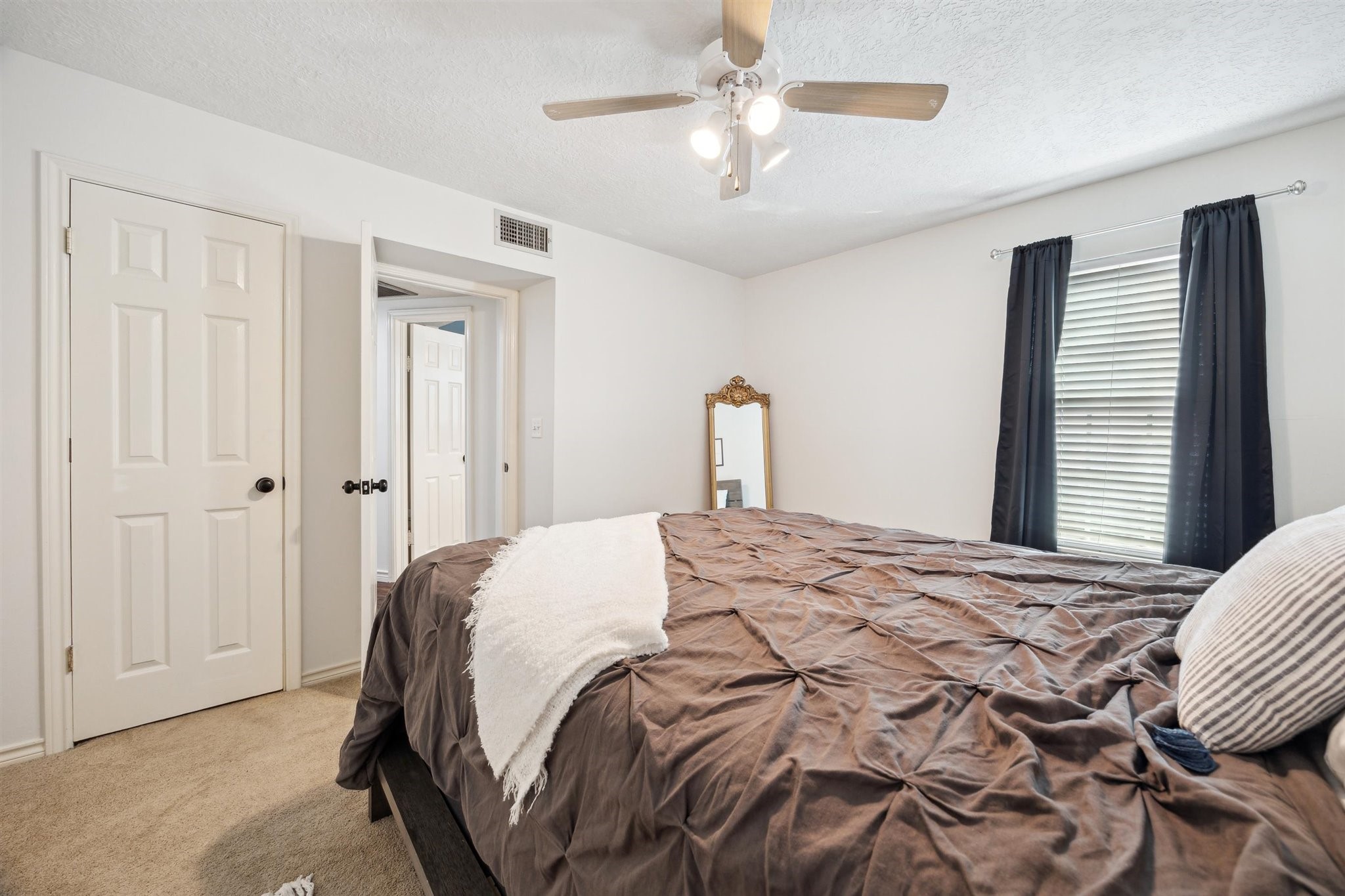 3702 Chanterway Street Bacliff, TX 77518 - Photo 6 of 19 a bedroom with a bed and a chandelier