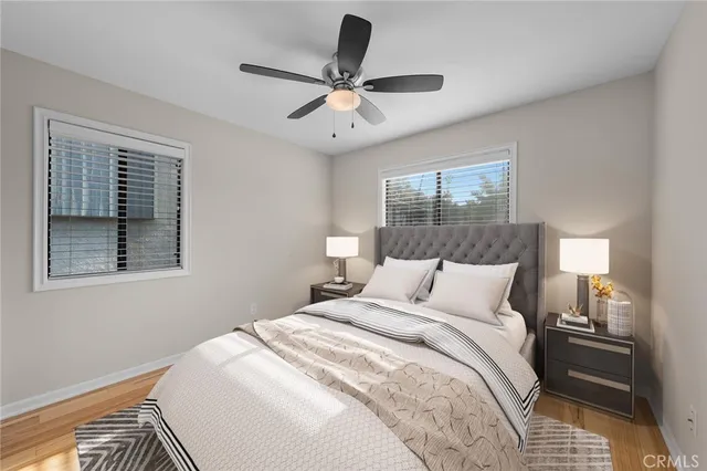 a bedroom with a large bed closet and a window