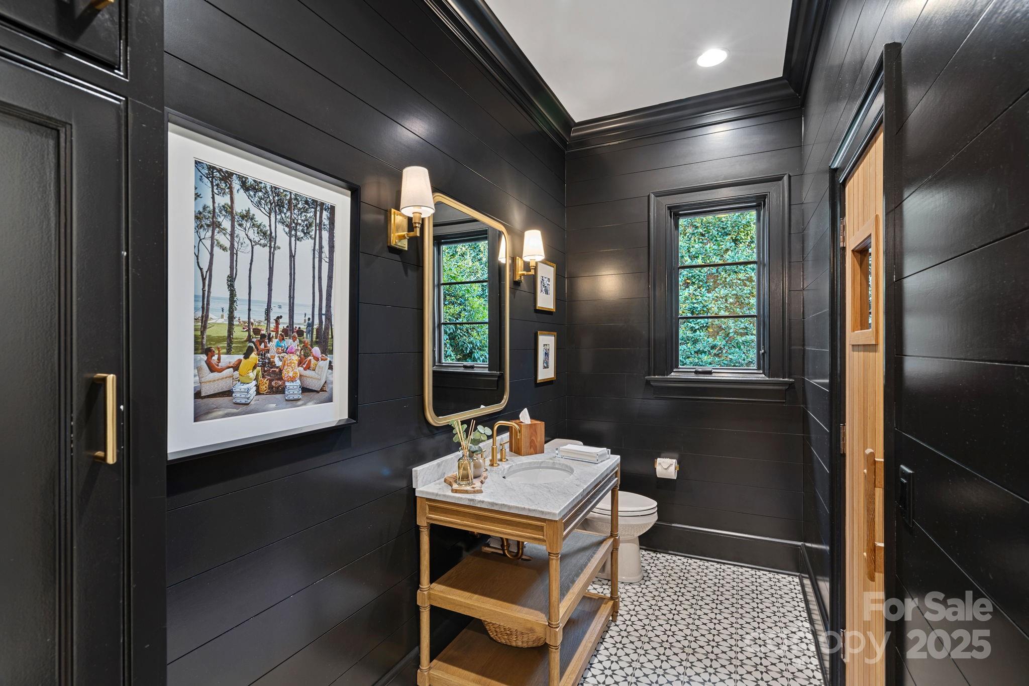 19117 Davidson-Concord Road Davidson, NC 28036 - Photo 17 of 48 a living room with a large window and a table