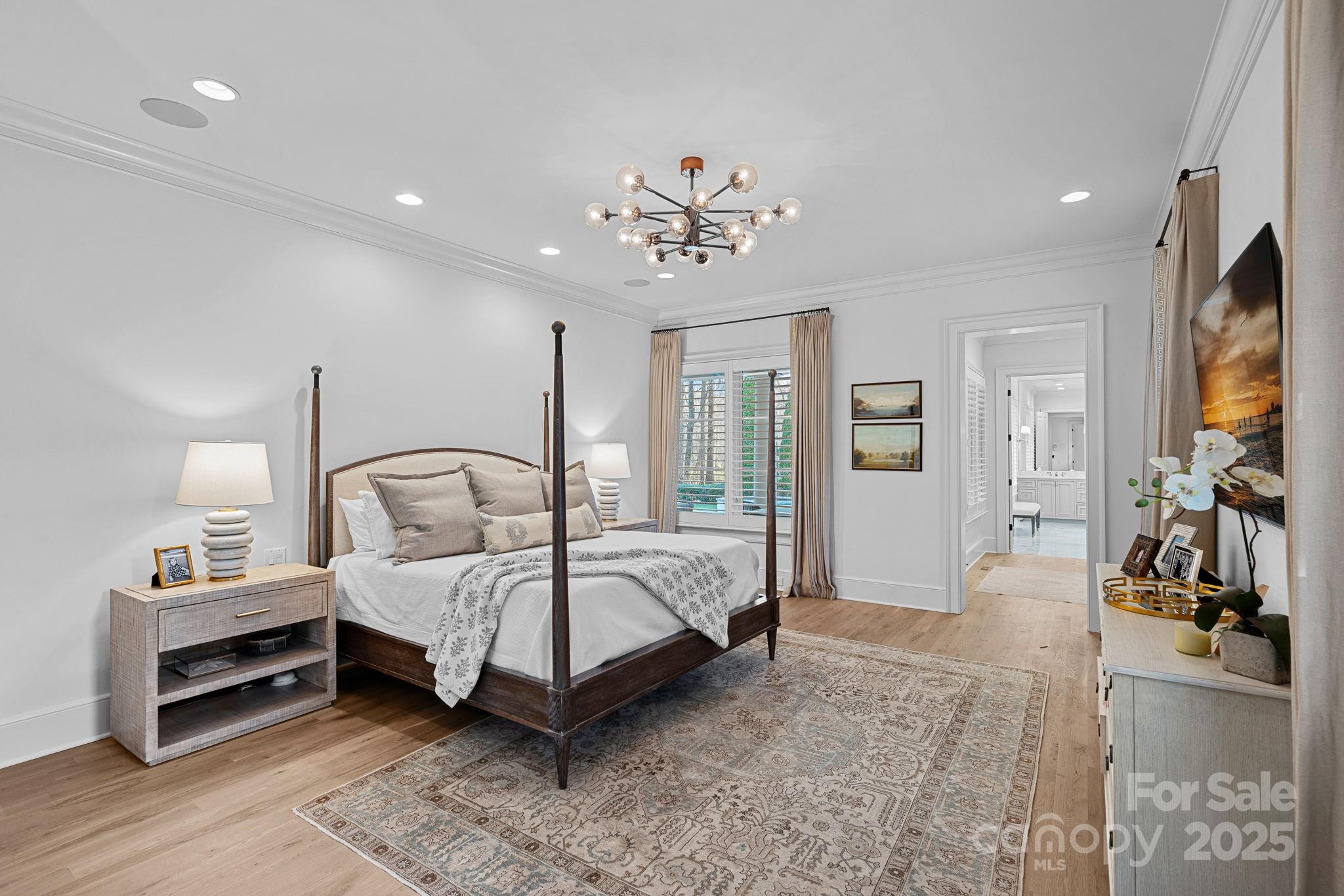 19117 Davidson-Concord Road Davidson, NC 28036 - Photo 20 of 48 a spacious bedroom with a bed a mirror and desk