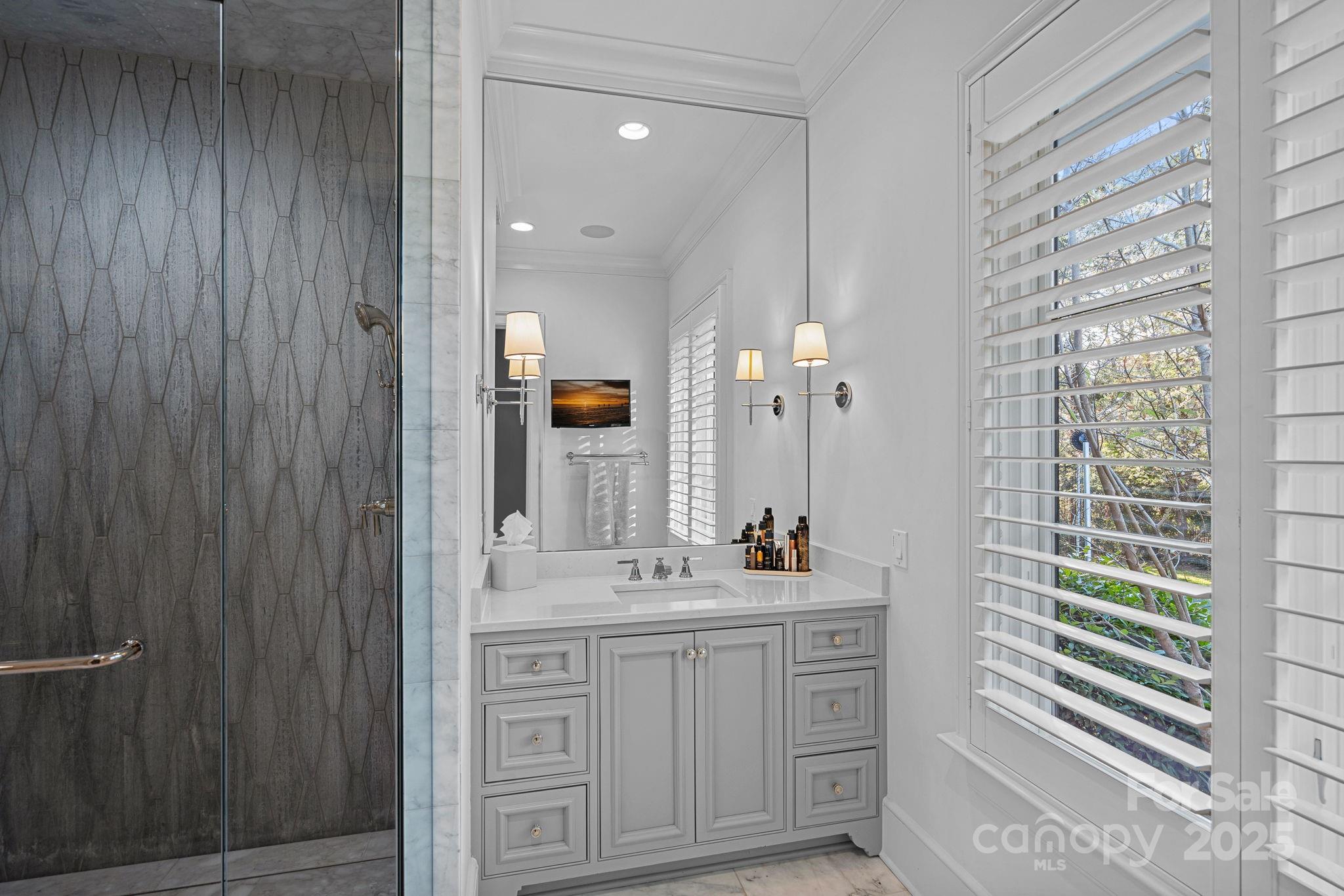 19117 Davidson-Concord Road Davidson, NC 28036 - Photo 23 of 48 a bathroom with a sink double vanity and a mirror