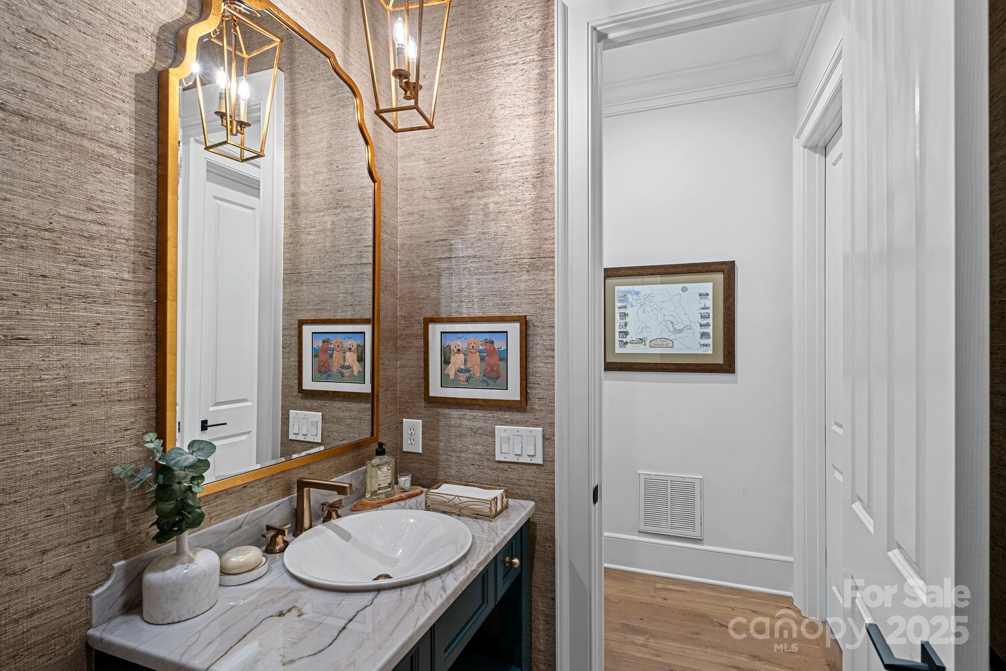 19117 Davidson-Concord Road Davidson, NC 28036 - Photo 25 of 48 a bathroom with a sink toilet and mirror