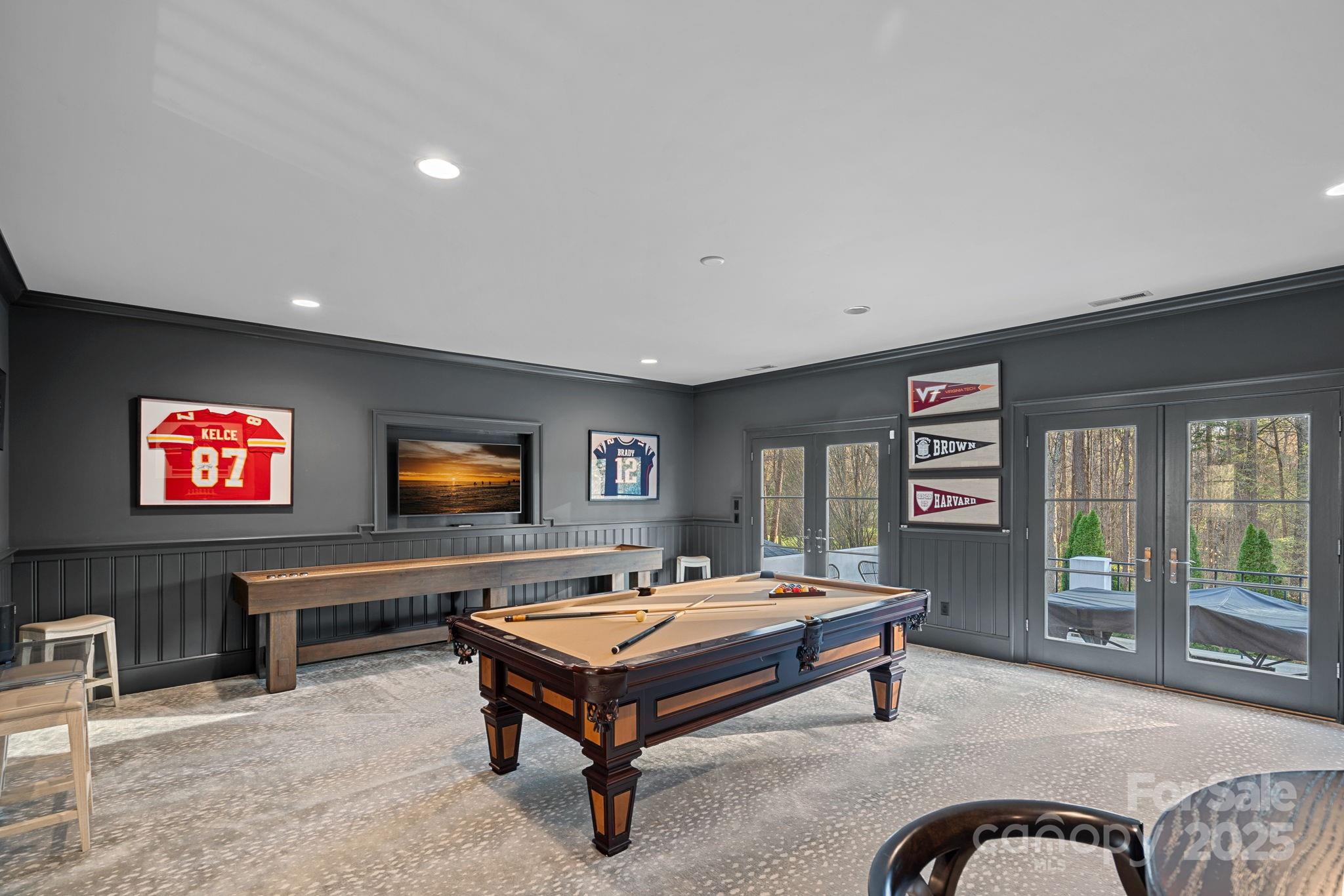 19117 Davidson-Concord Road Davidson, NC 28036 - Photo 26 of 48 a living room with furniture pool table and a flat screen tv