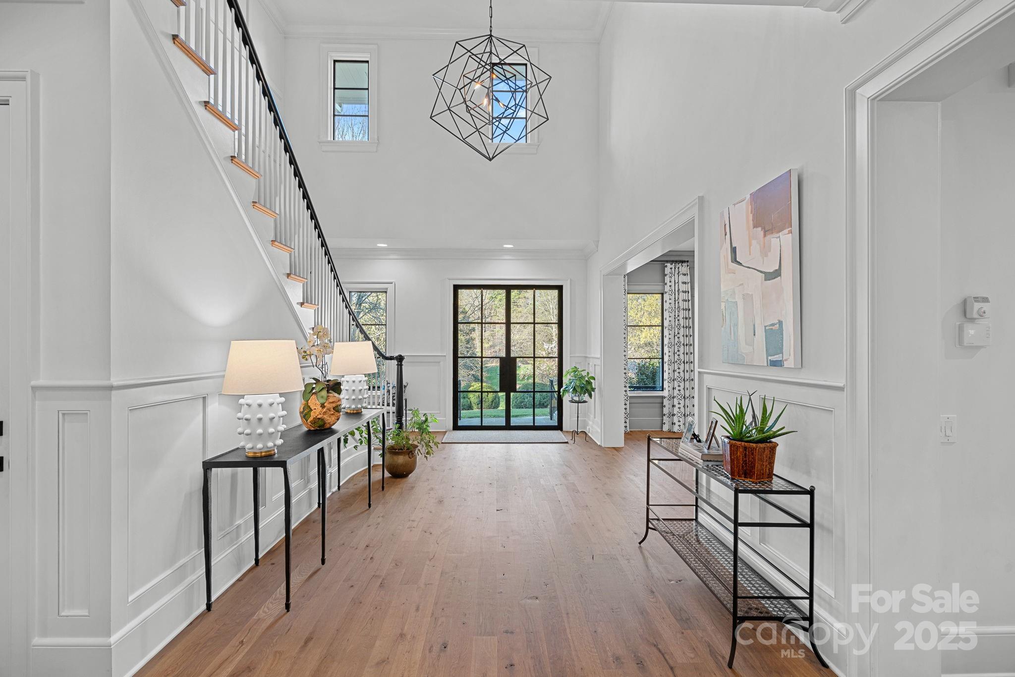 19117 Davidson-Concord Road Davidson, NC 28036 - Photo 3 of 48 a living room with furniture and wooden floor