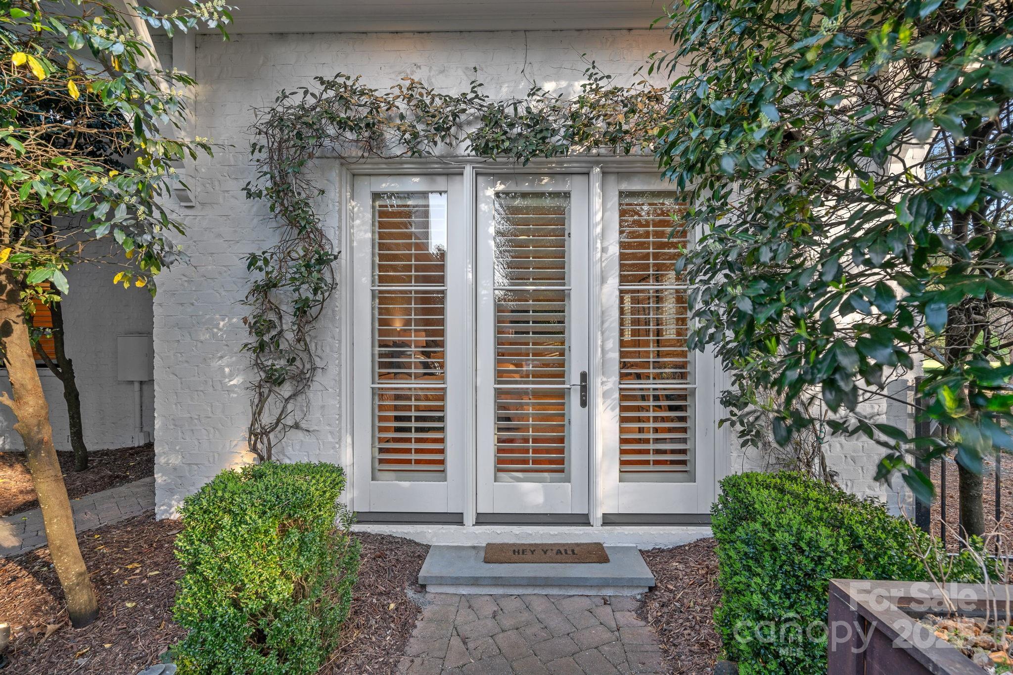 19117 Davidson-Concord Road Davidson, NC 28036 - Photo 33 of 48 a front view of a house with garden