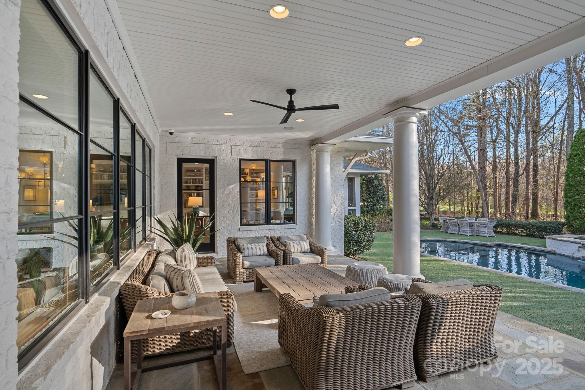19117 Davidson-Concord Road Davidson, NC 28036 - Photo 35 of 48 a living room with furniture and large windows