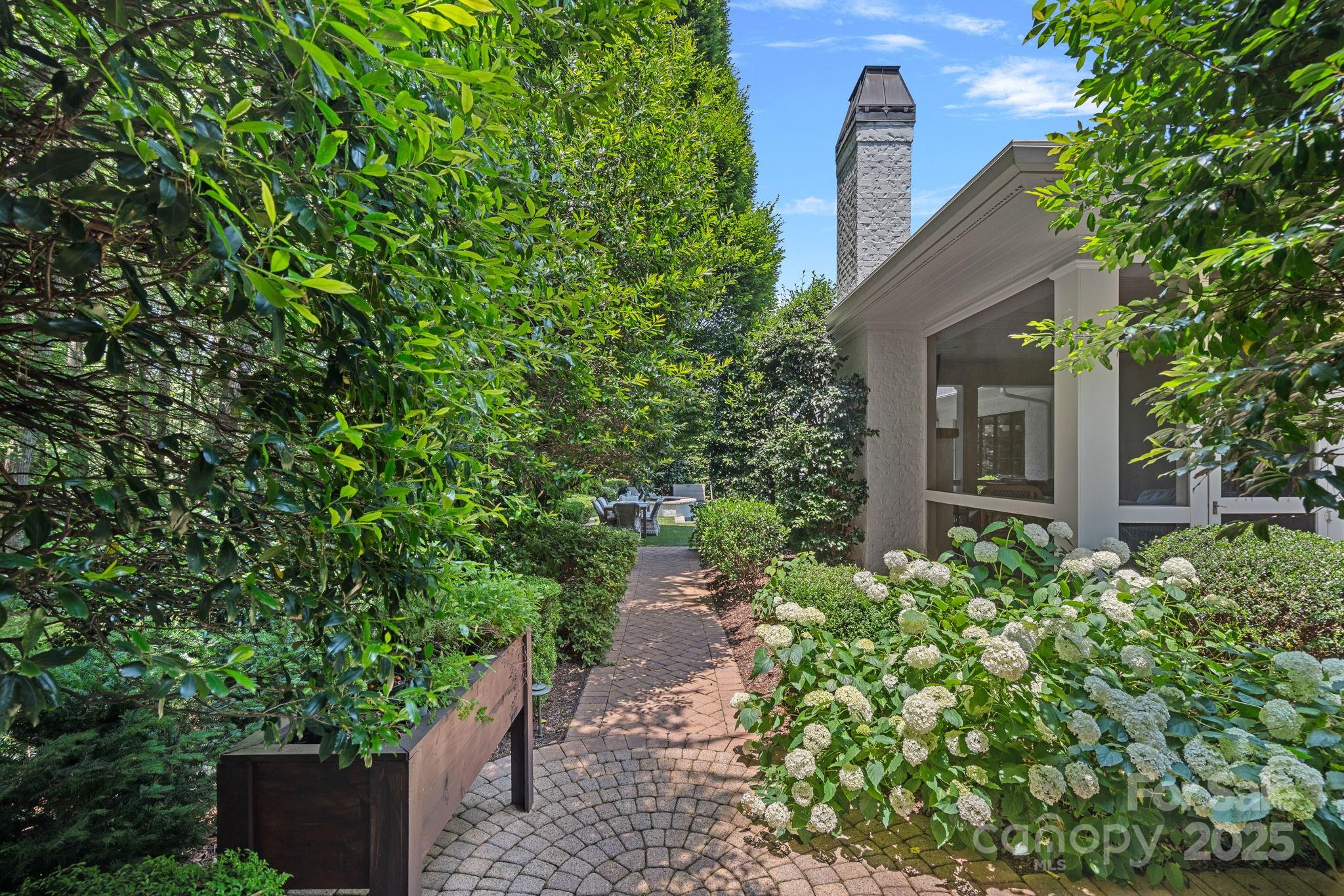 19117 Davidson-Concord Road Davidson, NC 28036 - Photo 39 of 48 a view of a pathway in outside of the house
