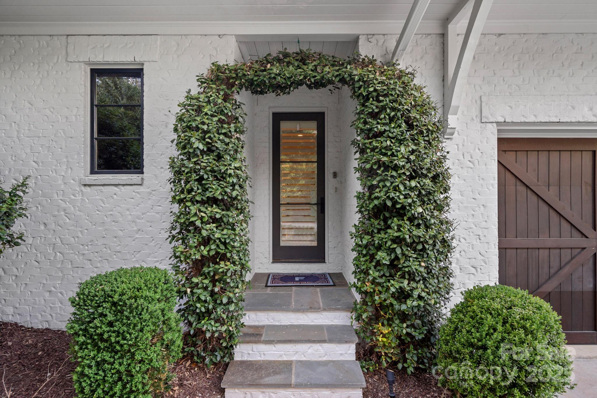 19117 Davidson-Concord Road Davidson, NC 28036 - Photo 44 of 48 a front view of a house with garden