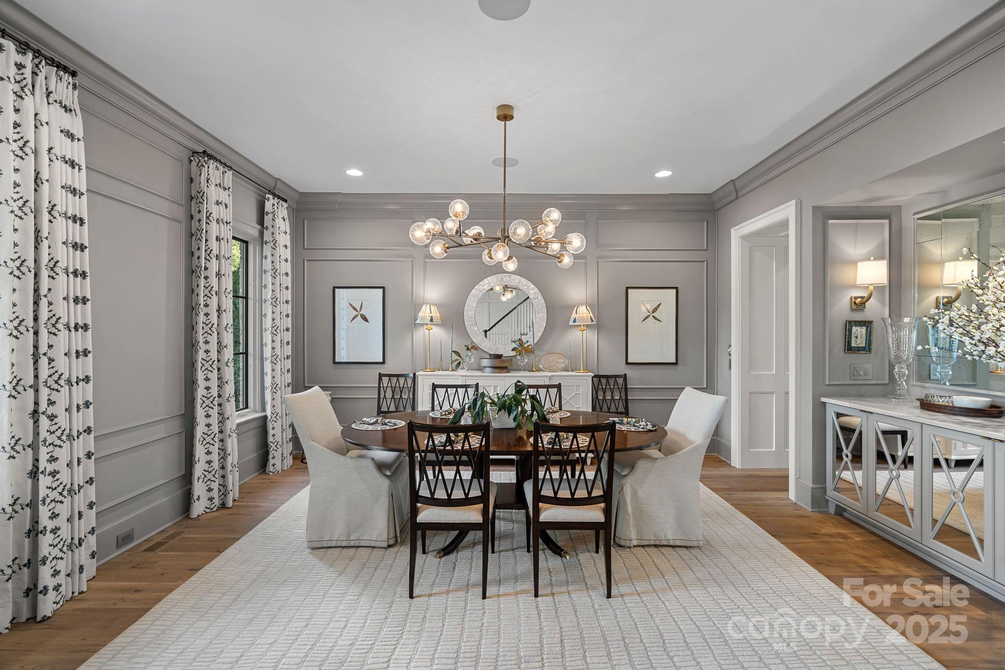 19117 Davidson-Concord Road Davidson, NC 28036 - Photo 5 of 48 a view of a dining room with furniture window and wooden floor