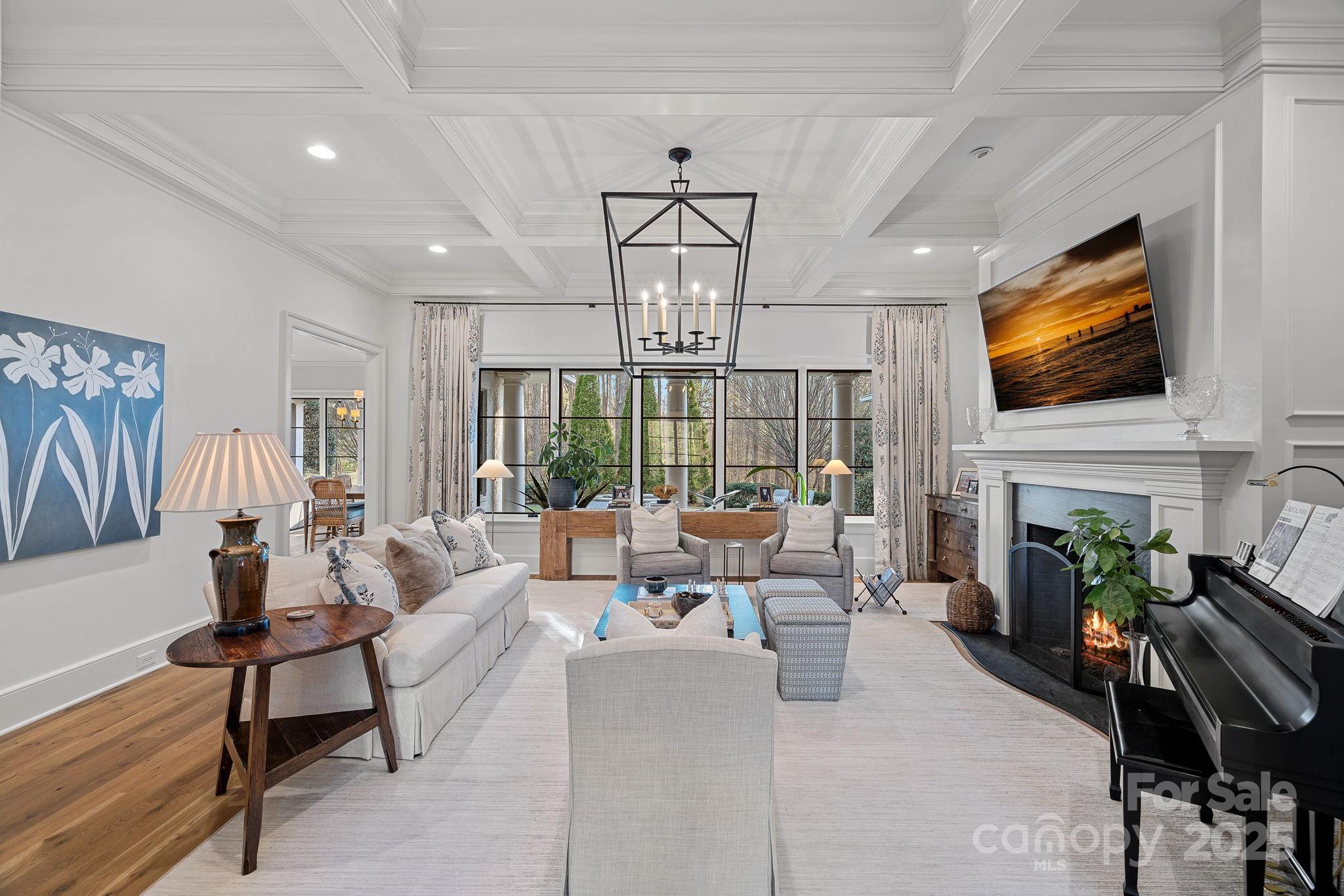 19117 Davidson-Concord Road Davidson, NC 28036 - Photo 7 of 48 a living room with fireplace furniture and a flat screen tv