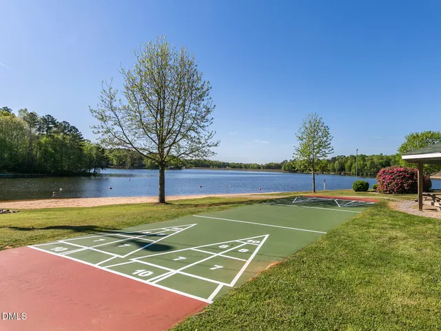 a view of a swimming pool with a table and chairs