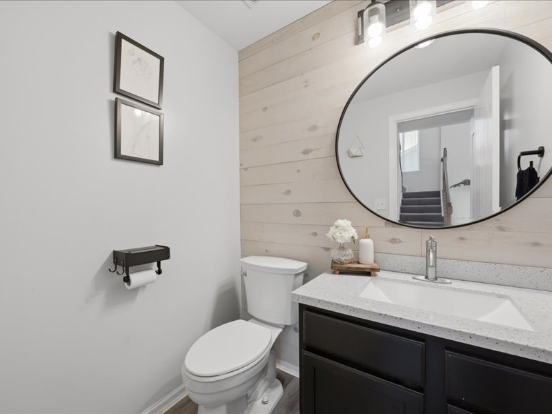 4201 Dillon Street Plano, IL 60545 - Photo 17 of 37 a bathroom with a sink a toilet and a mirror
