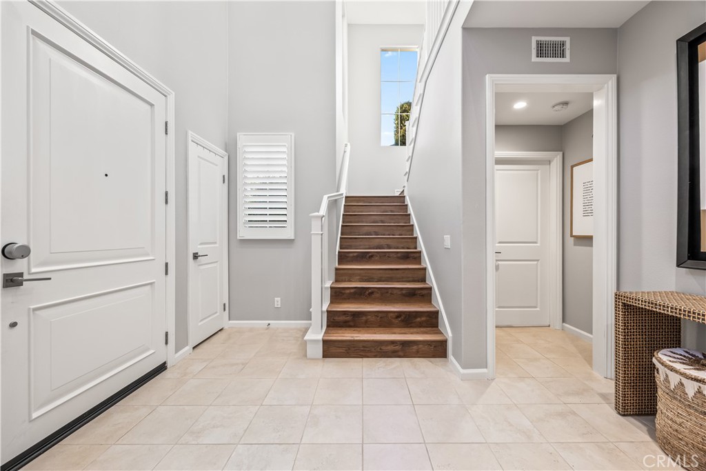 51 Decker Irvine, CA 92620 - Photo 20 of 49 a view of a hallway with entryway and stairs