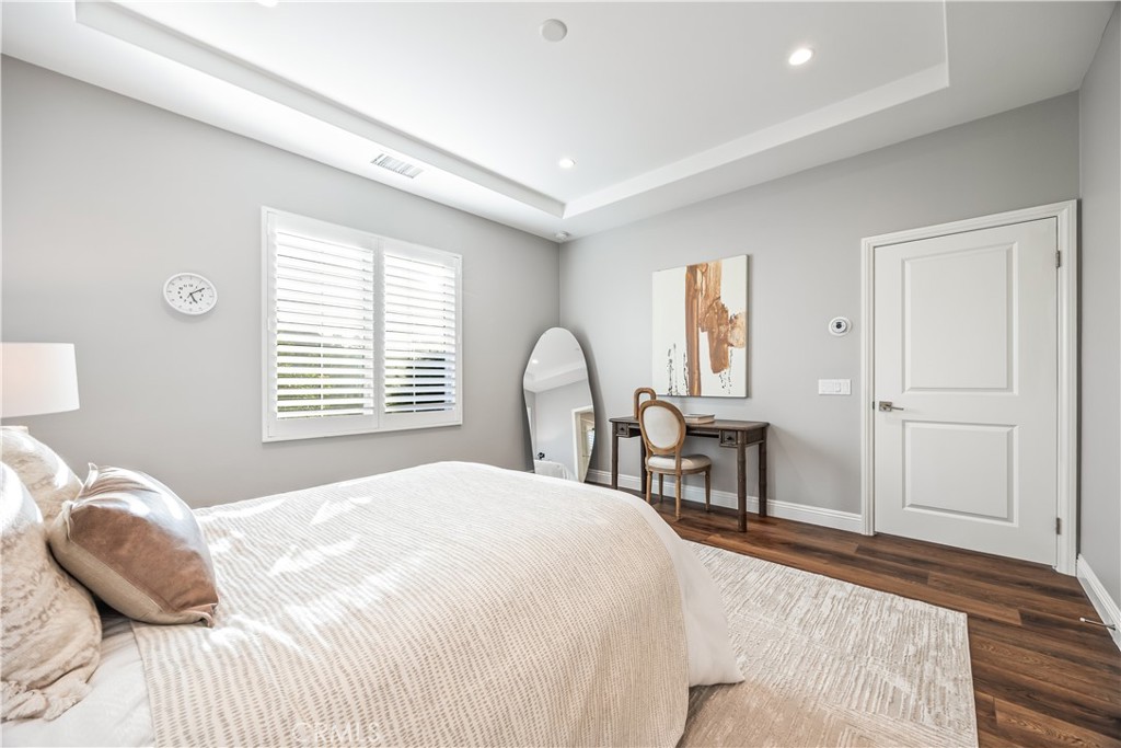 51 Decker Irvine, CA 92620 - Photo 26 of 49 a bedroom with a bed and a table with chair