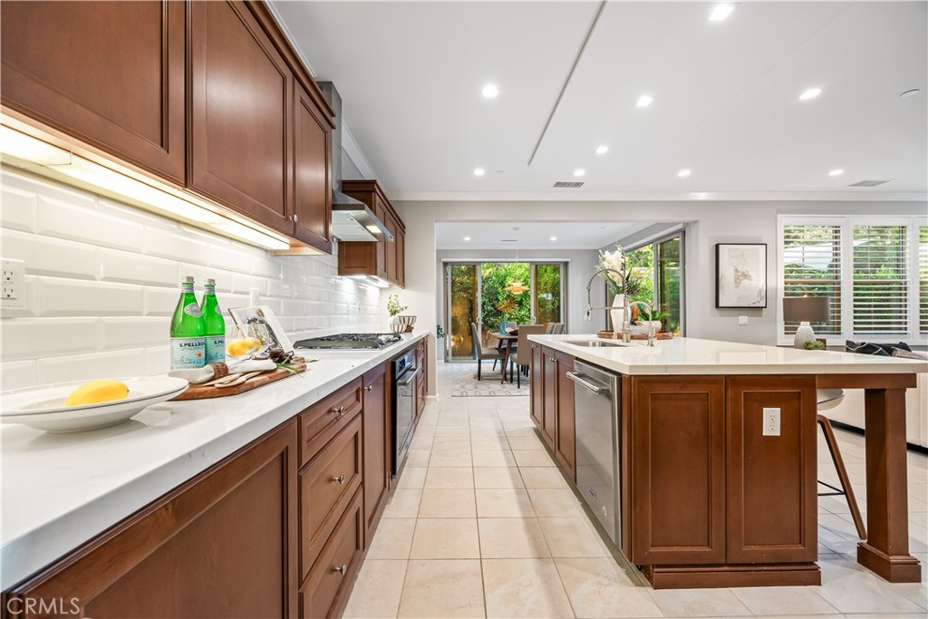 51 Decker Irvine, CA 92620 - Photo 8 of 49 a large kitchen with stainless steel appliances granite countertop a sink and counter space