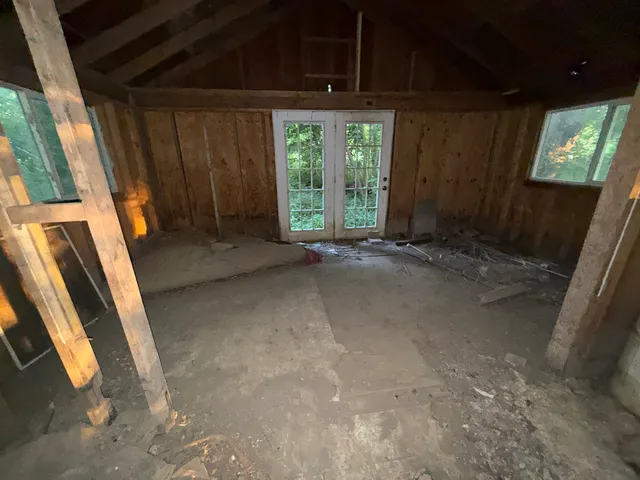 a view of an empty room with windows