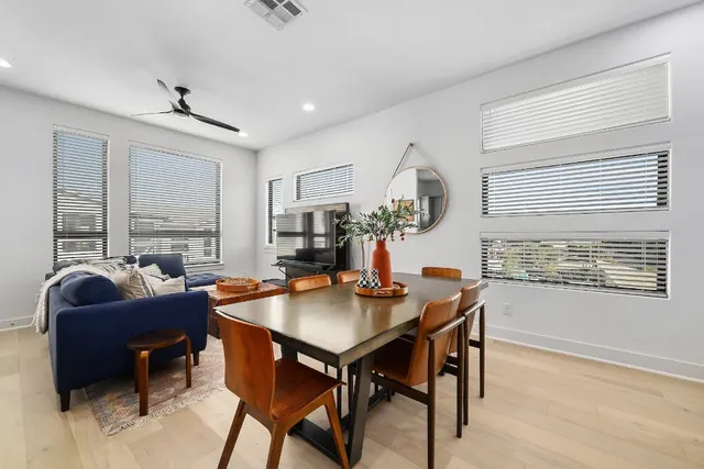 a dining room with furniture and window