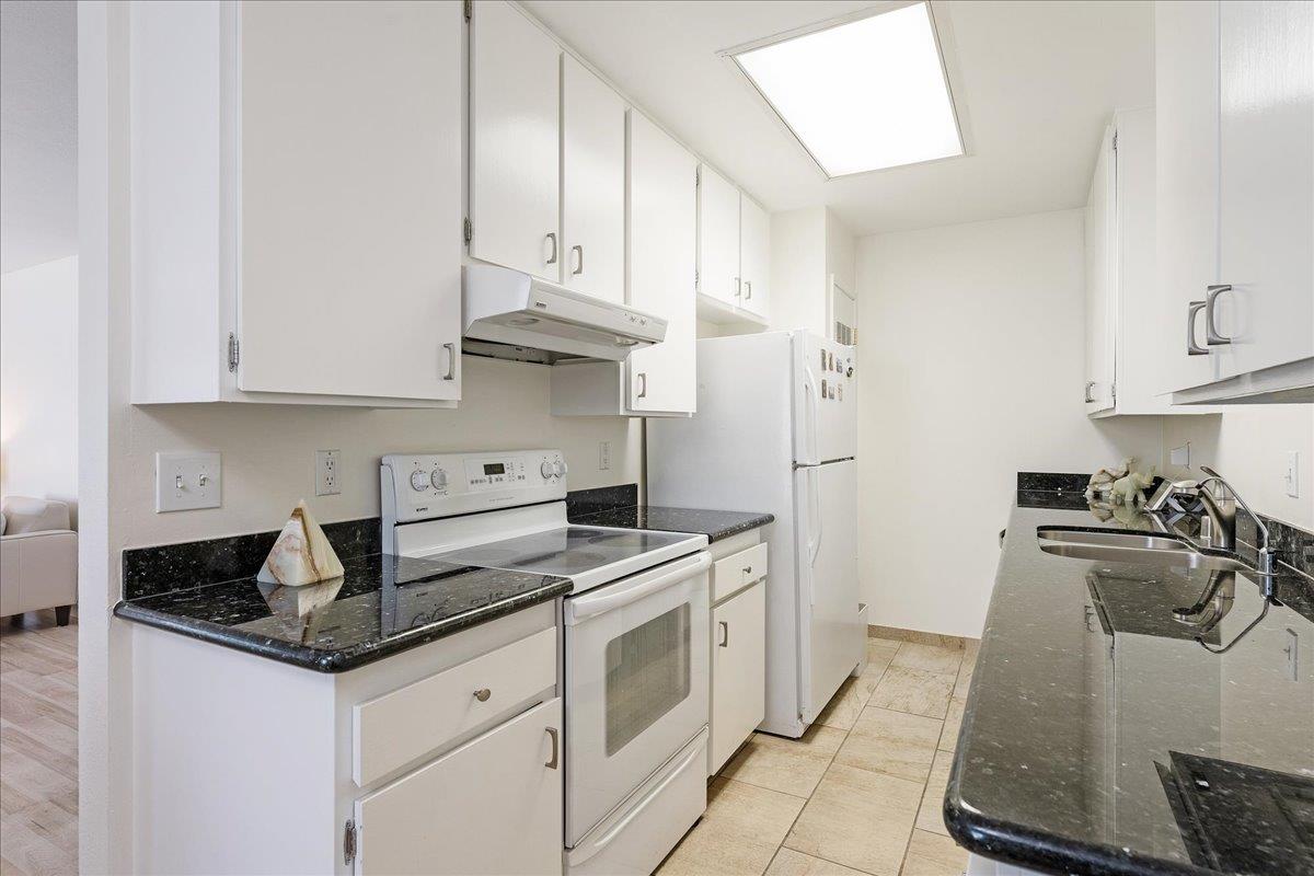 1416 Dolphin Drive Aptos, CA 95003 - Photo 14 of 40 a kitchen with stainless steel appliances granite countertop a sink stove and refrigerator