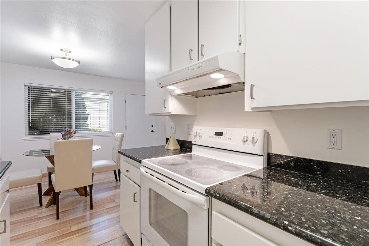 1416 Dolphin Drive Aptos, CA 95003 - Photo 17 of 40 a kitchen with a stove a table and chairs in it