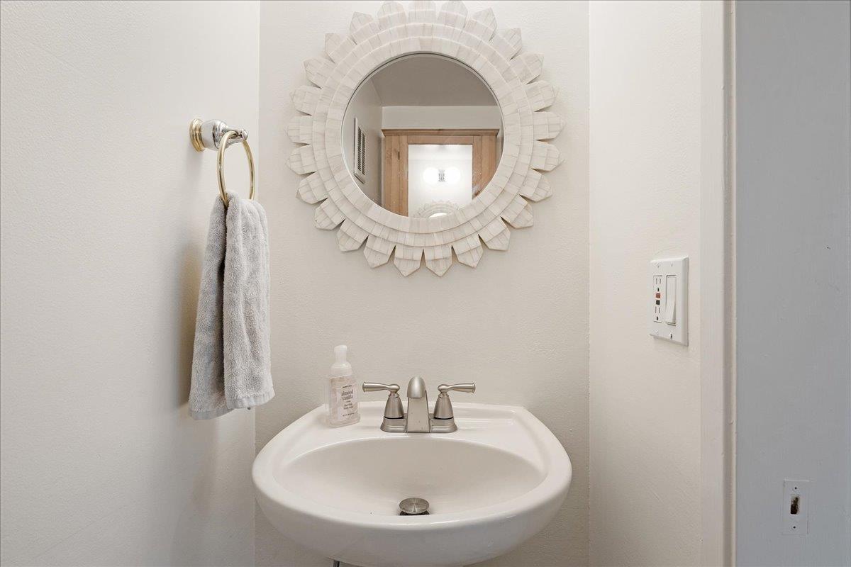 1416 Dolphin Drive Aptos, CA 95003 - Photo 18 of 40 a bathroom with a sink and a mirror