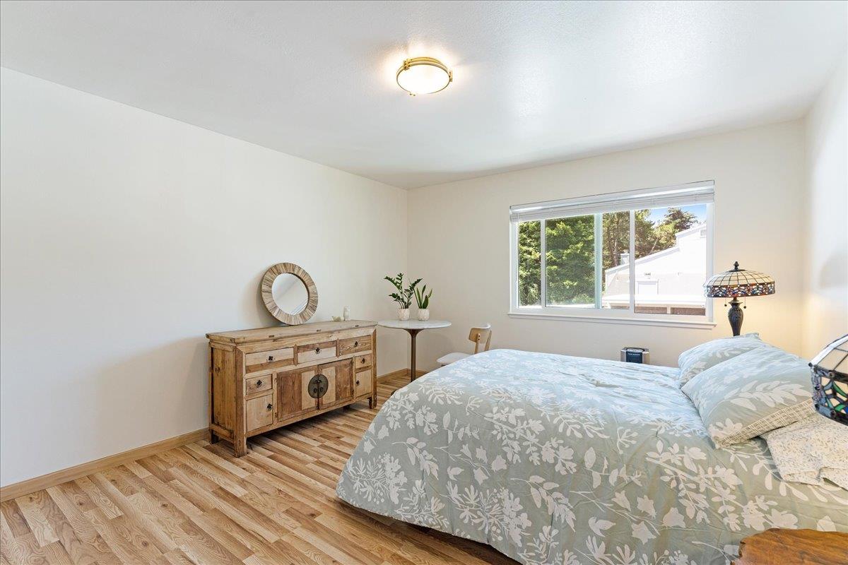 1416 Dolphin Drive Aptos, CA 95003 - Photo 25 of 40 a bedroom with a bed and a window