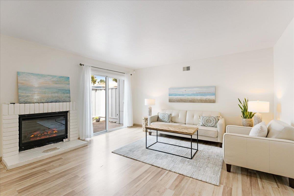 1416 Dolphin Drive Aptos, CA 95003 - Photo 4 of 40 a living room with furniture and a fireplace