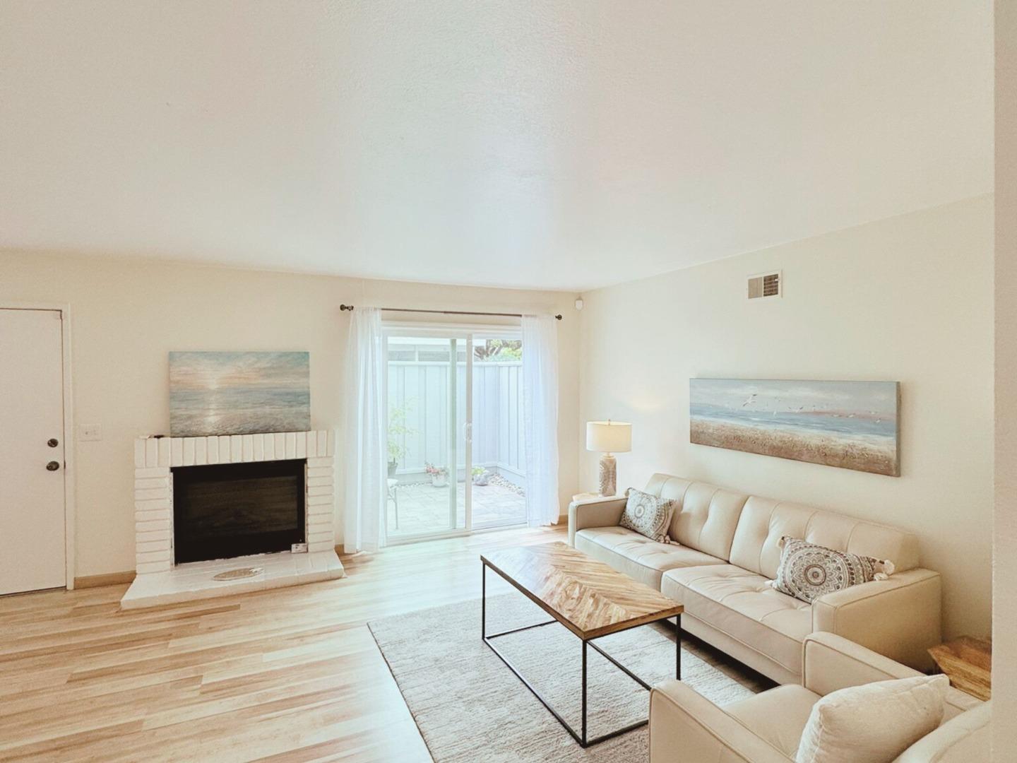 1416 Dolphin Drive Aptos, CA 95003 - Photo 6 of 40 a living room with furniture and a fireplace