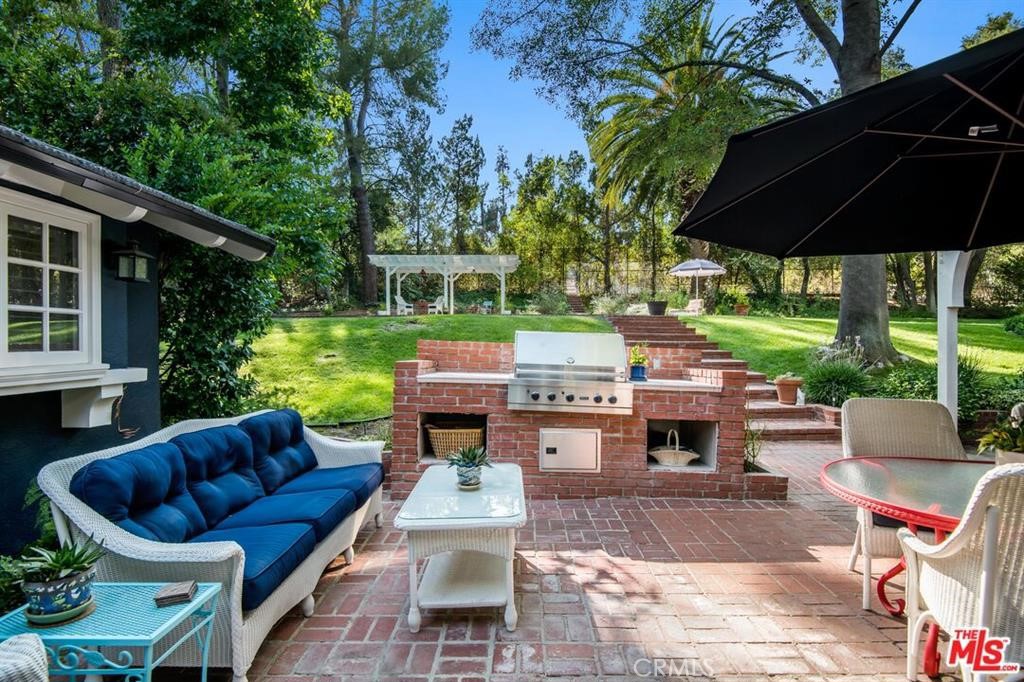 5255 Round Meadow Road Hidden Hills, CA 91302 - Photo 13 of 18 a backyard of a house with seating space