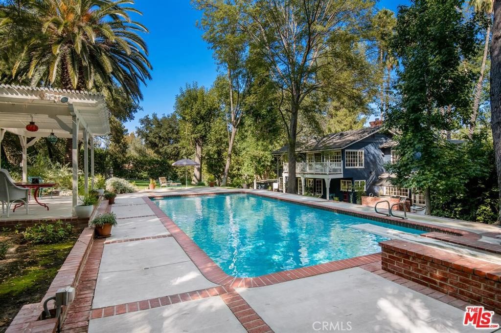 5255 Round Meadow Road Hidden Hills, CA 91302 - Photo 14 of 18 a view of swimming pool with a patio