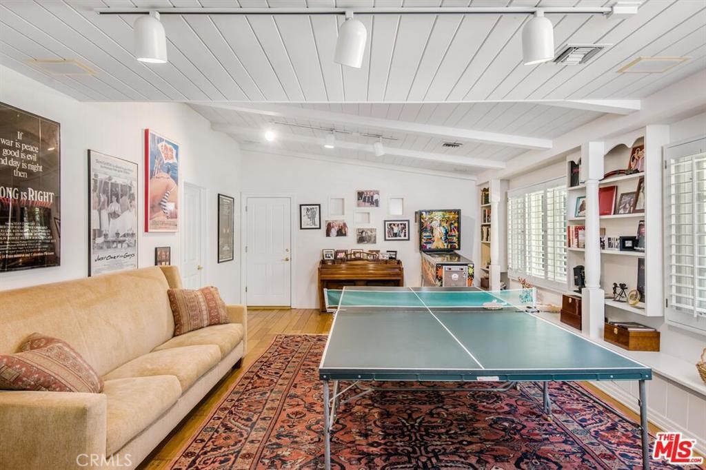 5255 Round Meadow Road Hidden Hills, CA 91302 - Photo 6 of 18 a living room with furniture a table and kitchen view