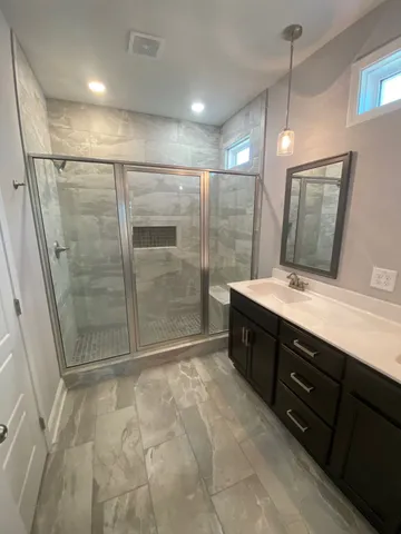 a bathroom with a sink and a mirror