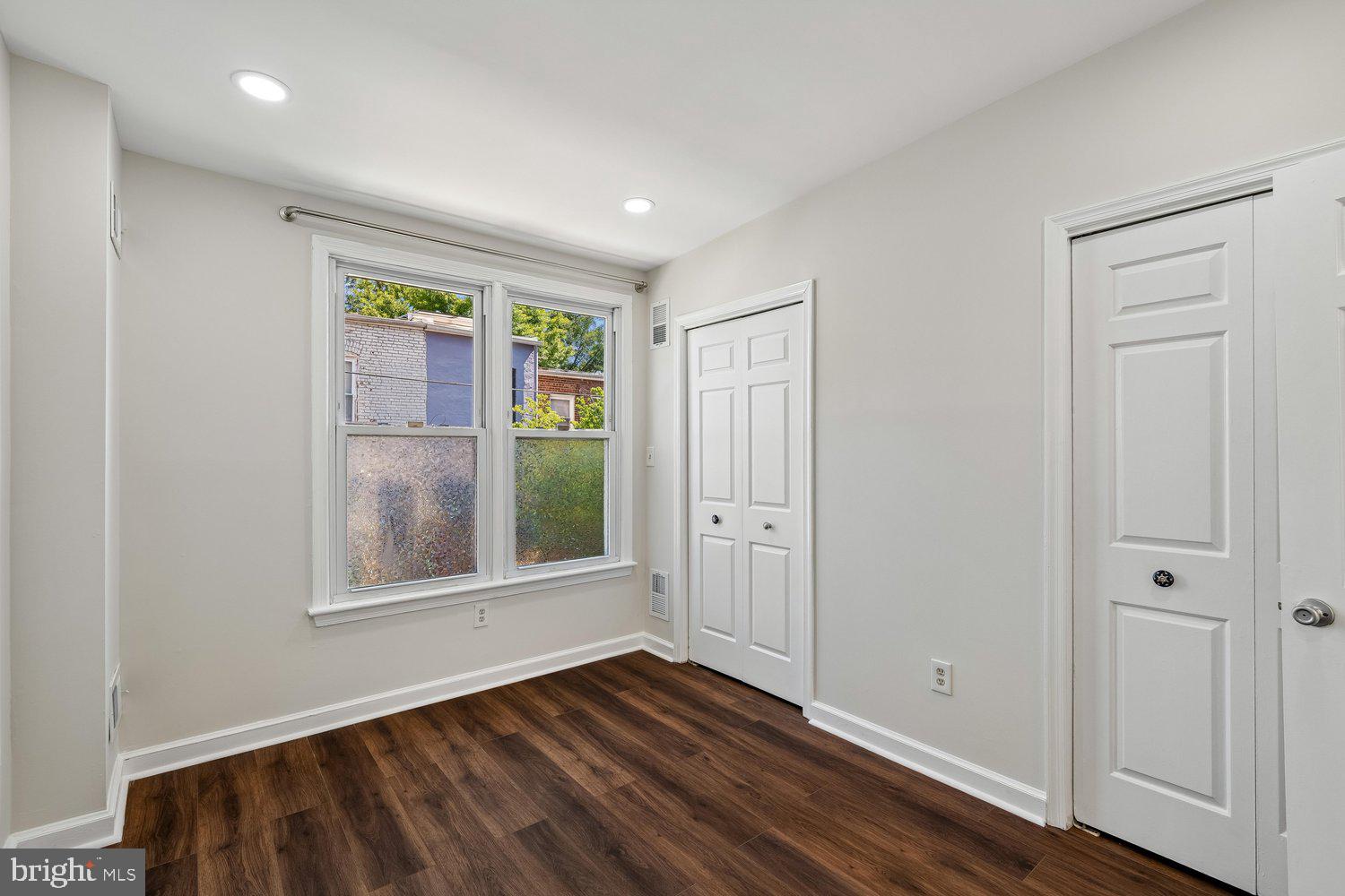 1652 Kramer Street Northeast Washington, DC 20002 - Photo 20 of 26 a view of empty room with wooden floor and fan