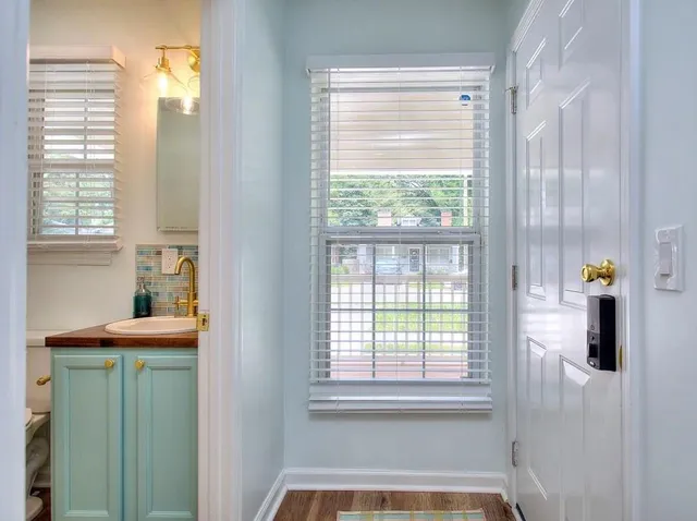 a bathroom with a bathtub and a window