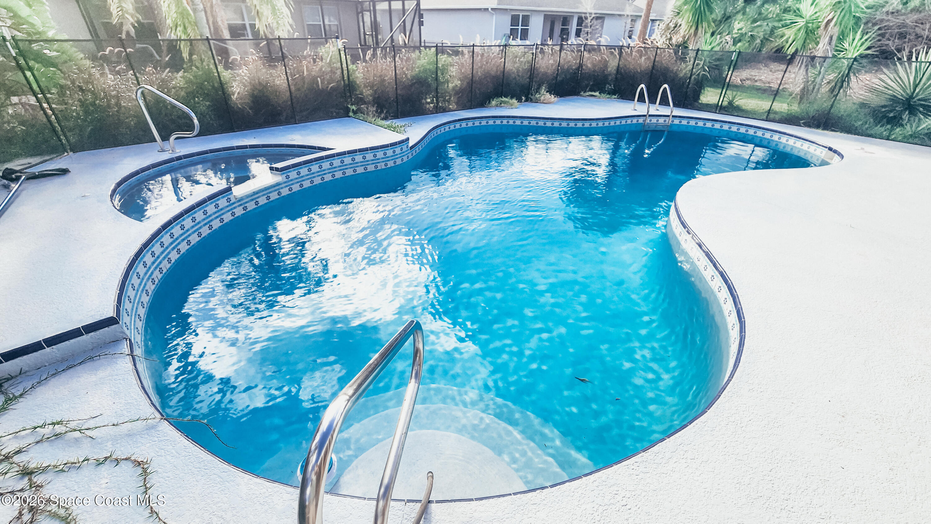 1521 Barber Street Sebastian, FL 32958 - Photo 2 of 33 a view of a swimming pool with a yard