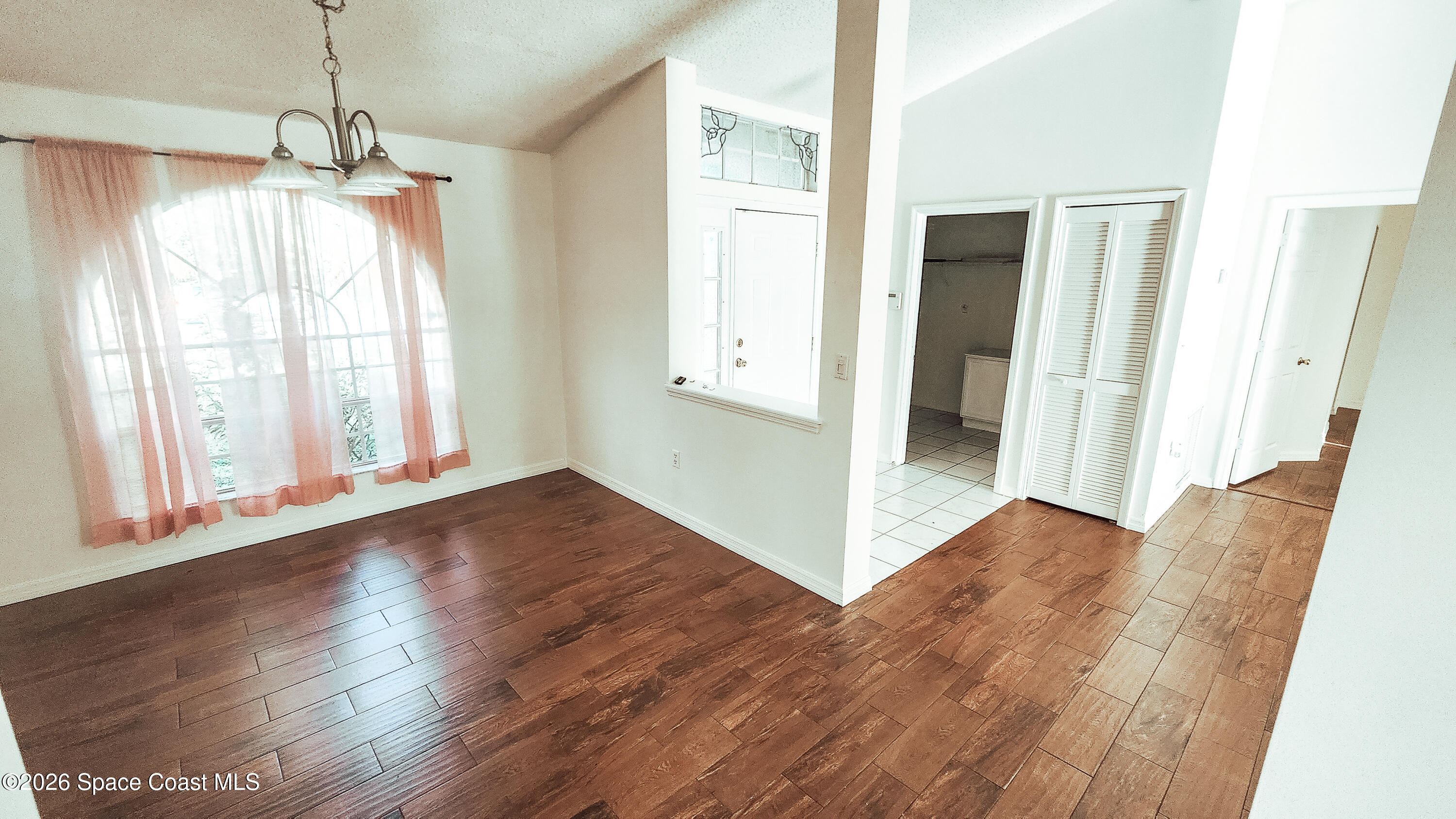 1521 Barber Street Sebastian, FL 32958 - Photo 23 of 33 a view of a room with wooden floor and front door
