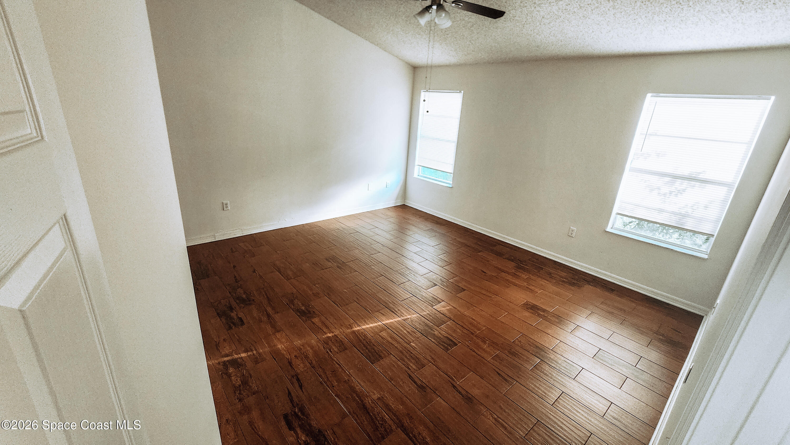1521 Barber Street Sebastian, FL 32958 - Photo 28 of 33 a view of wooden floor and windows in a room