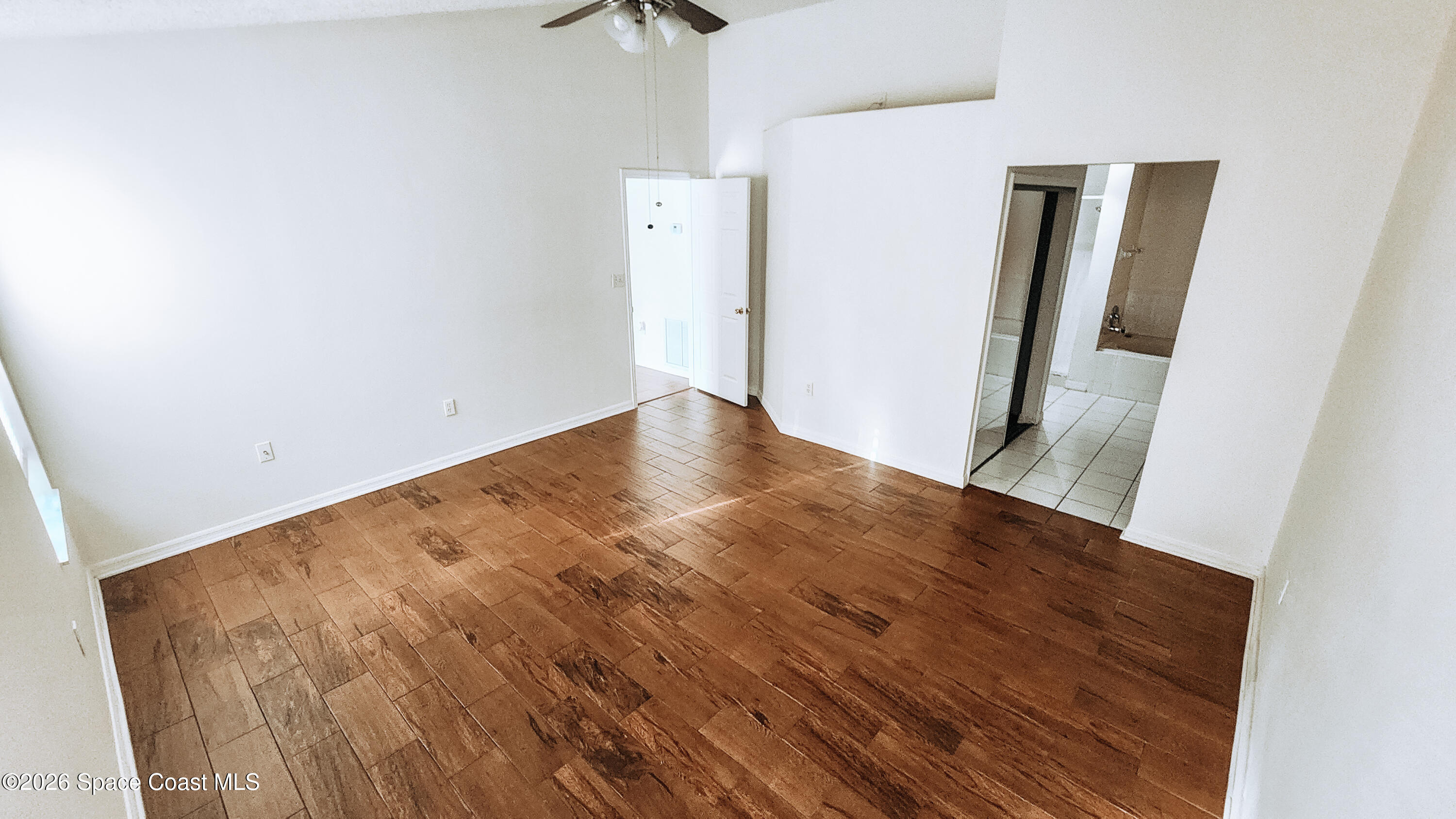 1521 Barber Street Sebastian, FL 32958 - Photo 29 of 33 an empty room with wooden floor and closet