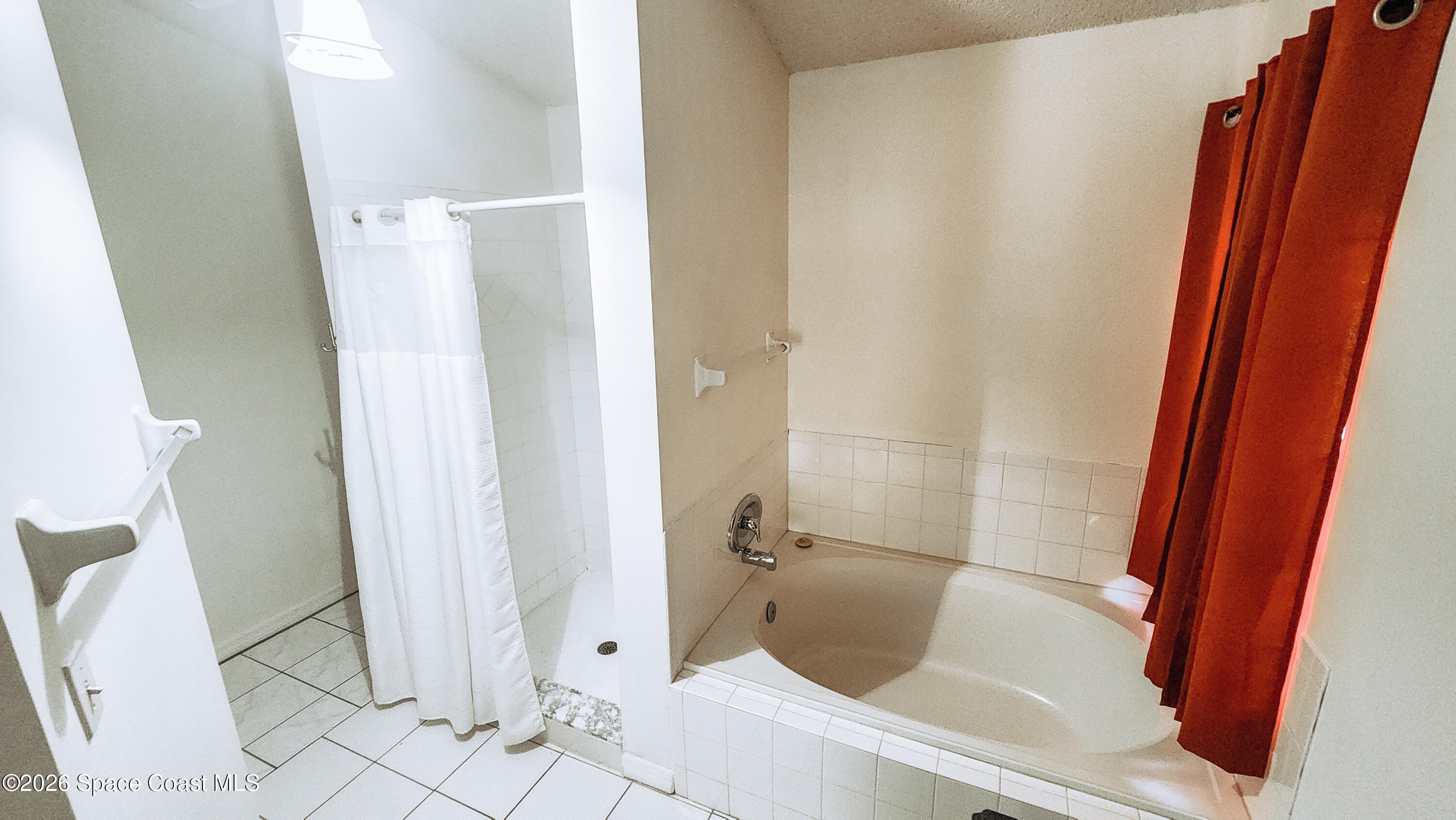 1521 Barber Street Sebastian, FL 32958 - Photo 33 of 33 a bathroom with a tub and shower