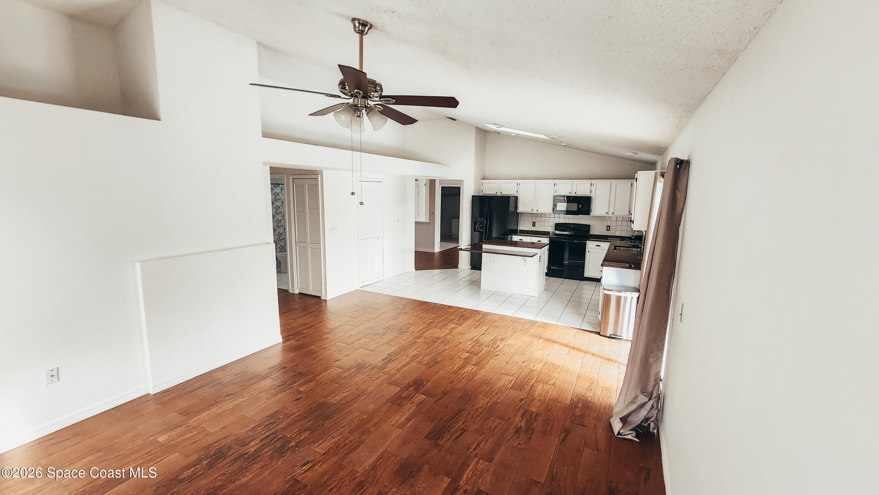 1521 Barber Street Sebastian, FL 32958 - Photo 9 of 33 a view of a living room with wooden floor