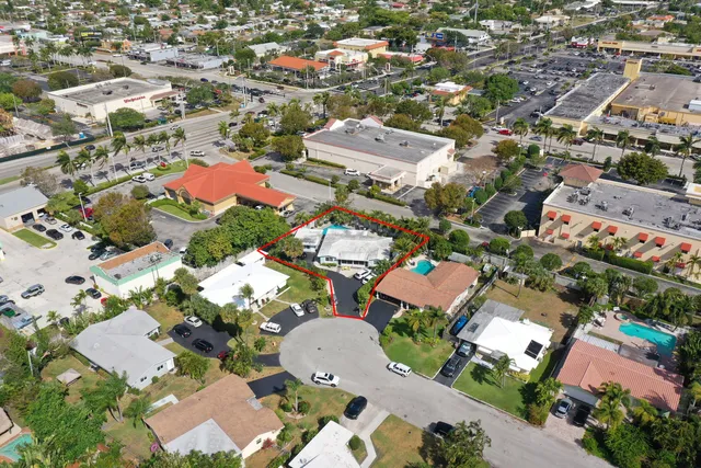 an aerial view of residential houses with outdoor space