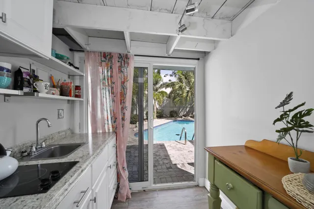 a kitchen with a sink stove and refrigerator