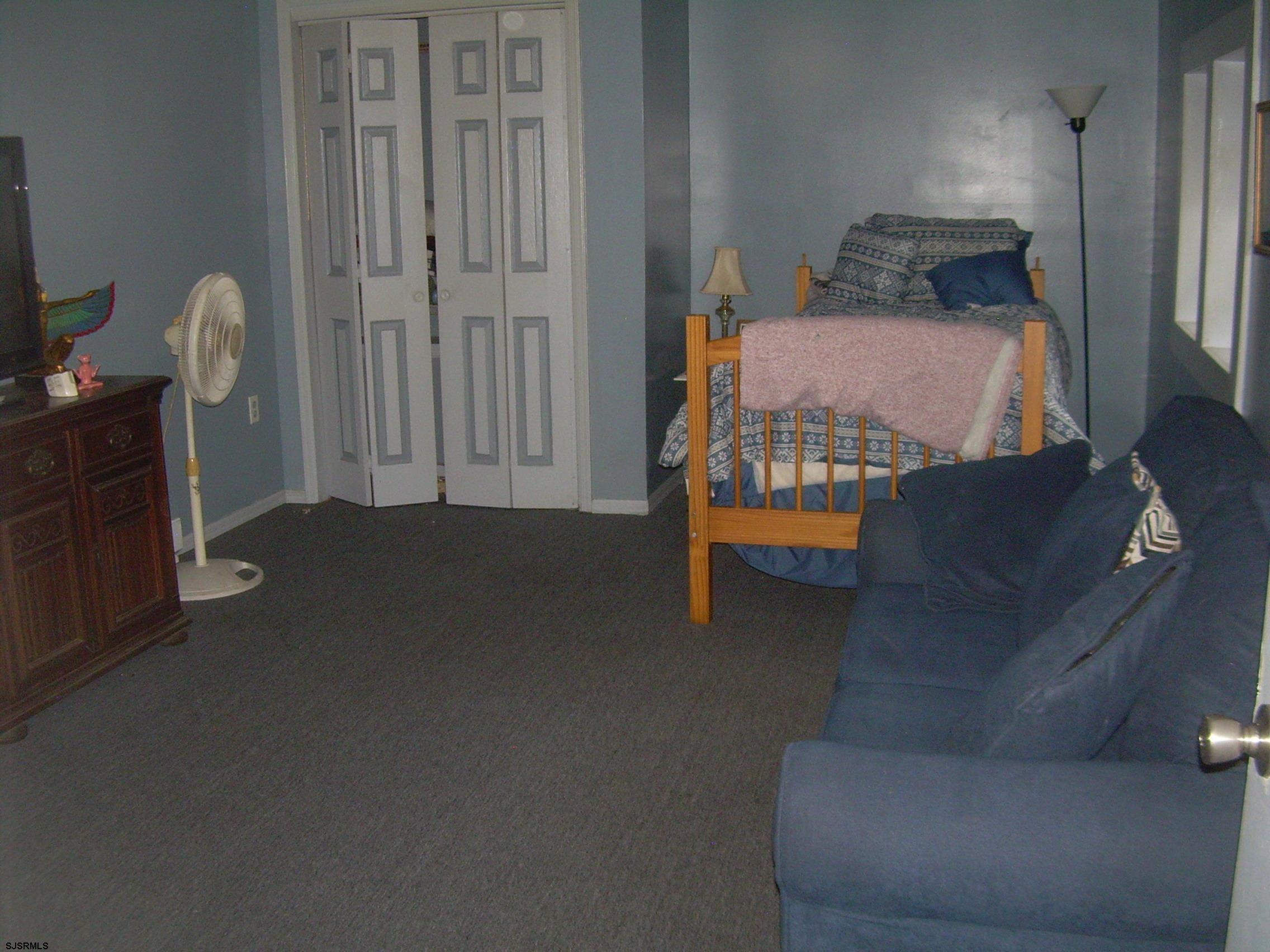 5257 Pleasant Mills Road Hammonton, NJ 08037 - Photo 16 of 27 a bedroom with furniture and a window