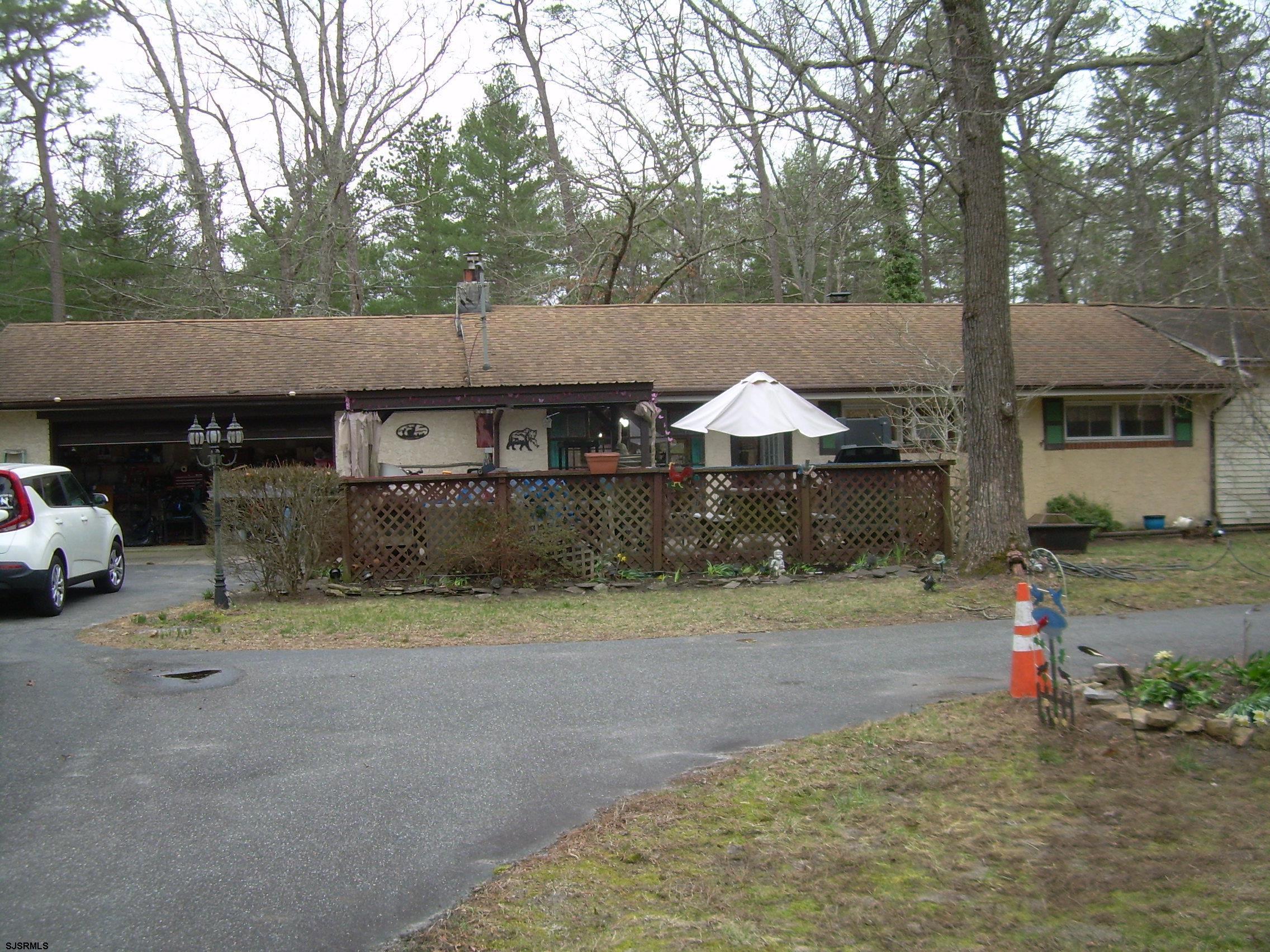 5257 Pleasant Mills Road Hammonton, NJ 08037 - Photo 2 of 27 a front view of a house with a yard and garage