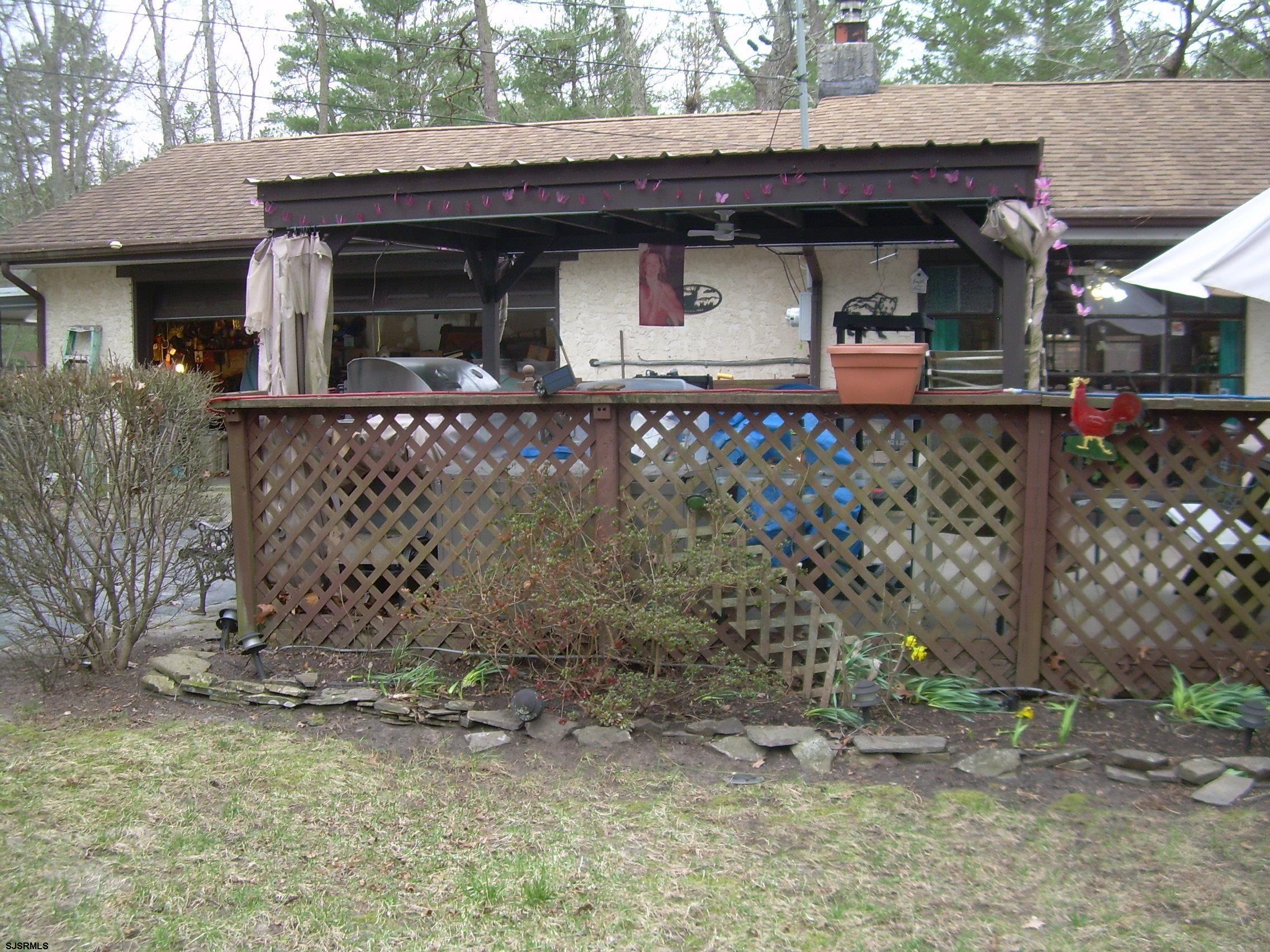 5257 Pleasant Mills Road Hammonton, NJ 08037 - Photo 23 of 27 a front view of a house with garden
