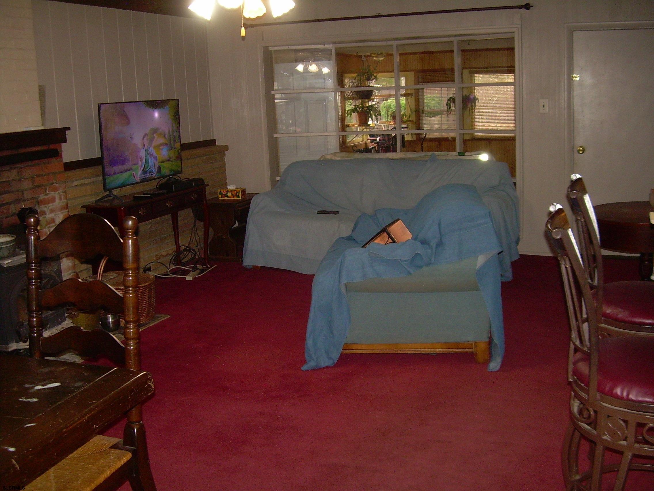 5257 Pleasant Mills Road Hammonton, NJ 08037 - Photo 9 of 27 a living room with furniture and a flat screen tv