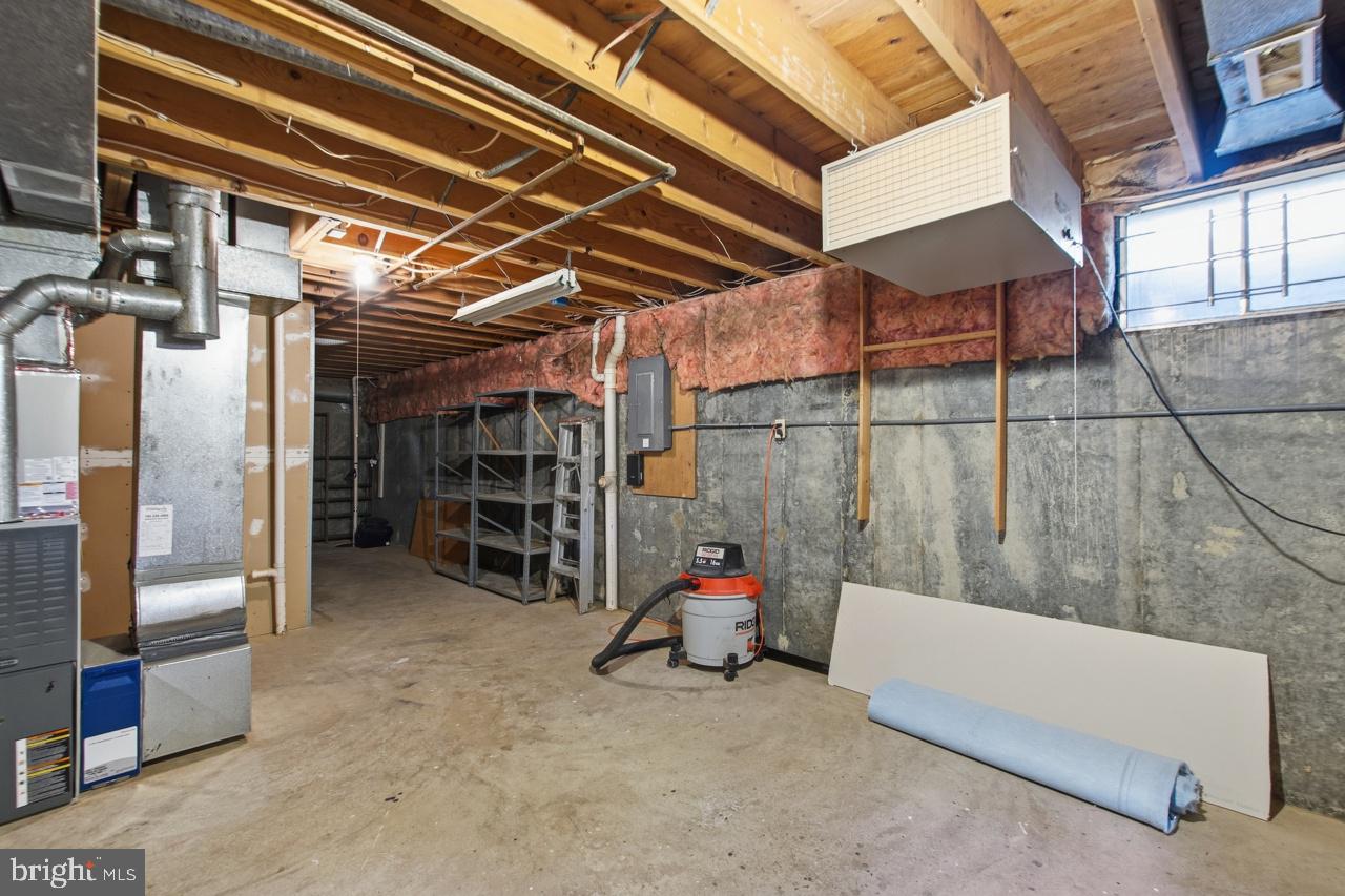 7100 Counter Place Burke, VA 22015 - Photo 48 of 54 Work room with air filter and work bench