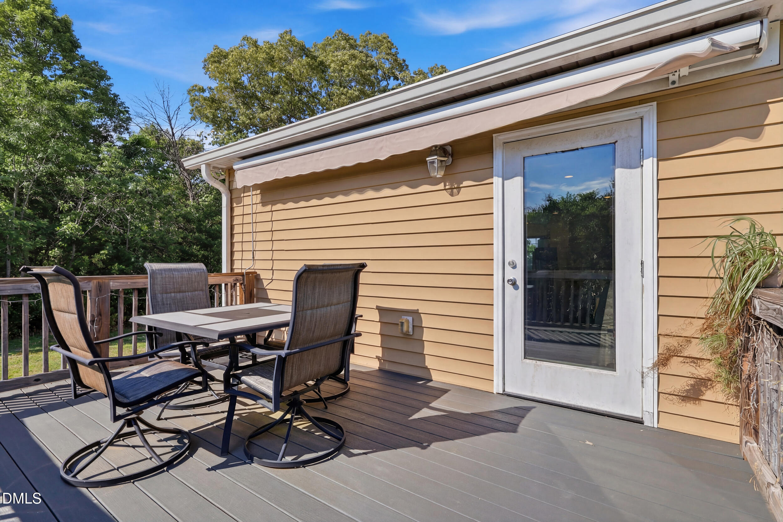 2631 South Jim Minor Road Haw River, NC 27258 - Photo 39 of 62 a view of a patio with table and chairs with wooden floor and fence