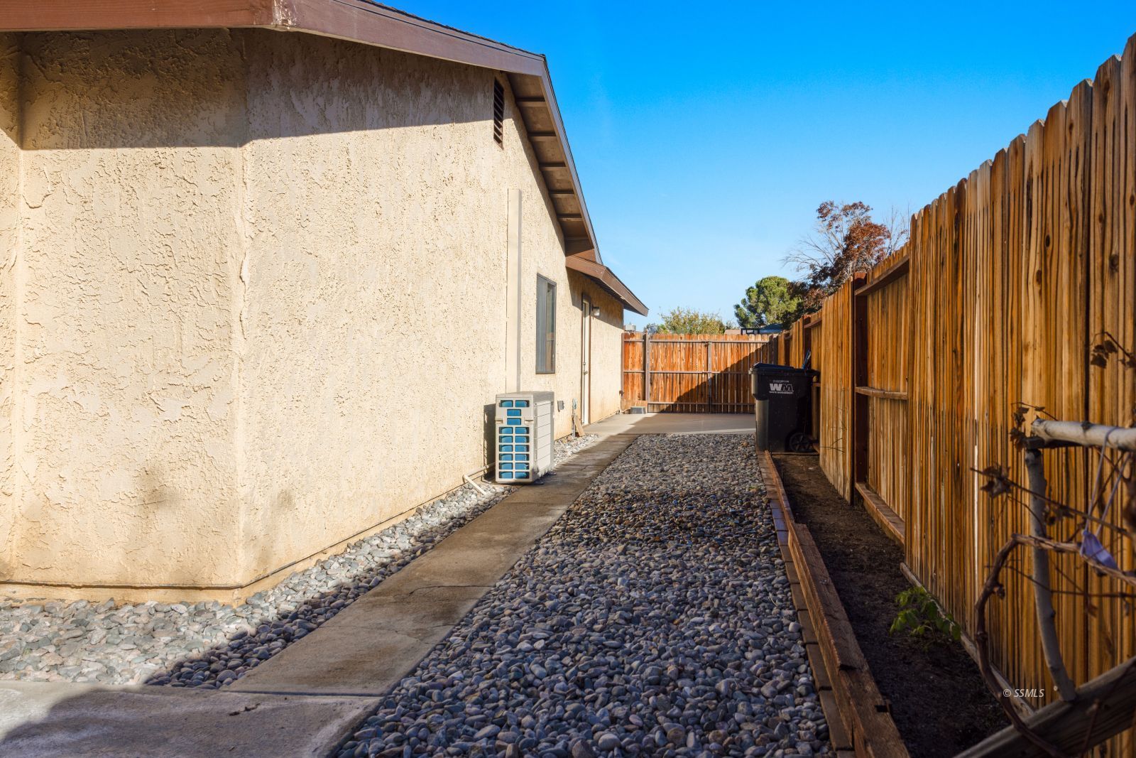 135 Chambers Street Ridgecrest, CA 93555 - Photo 25 of 26 a view of a pathway of a house with wooden fence