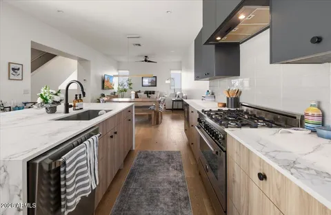 a view of kitchen island with granite countertop living room